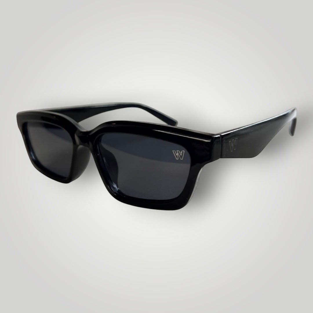 W One Brand Store black acetate rectangular cat-eye sunglasses with dark grey lenses and subtle 'W' logo.