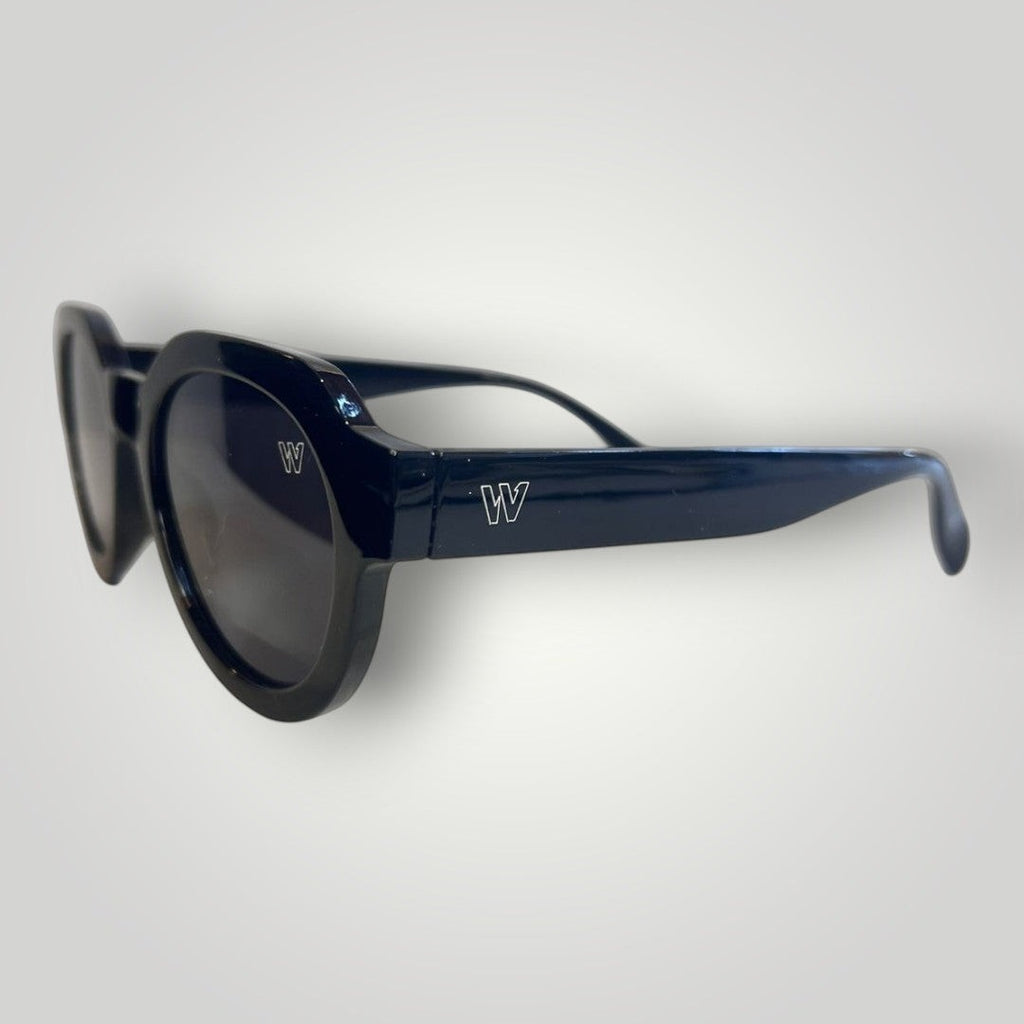W One Brand Store black acetate round sunglasses with black lenses and subtle 'W' logo detail.
