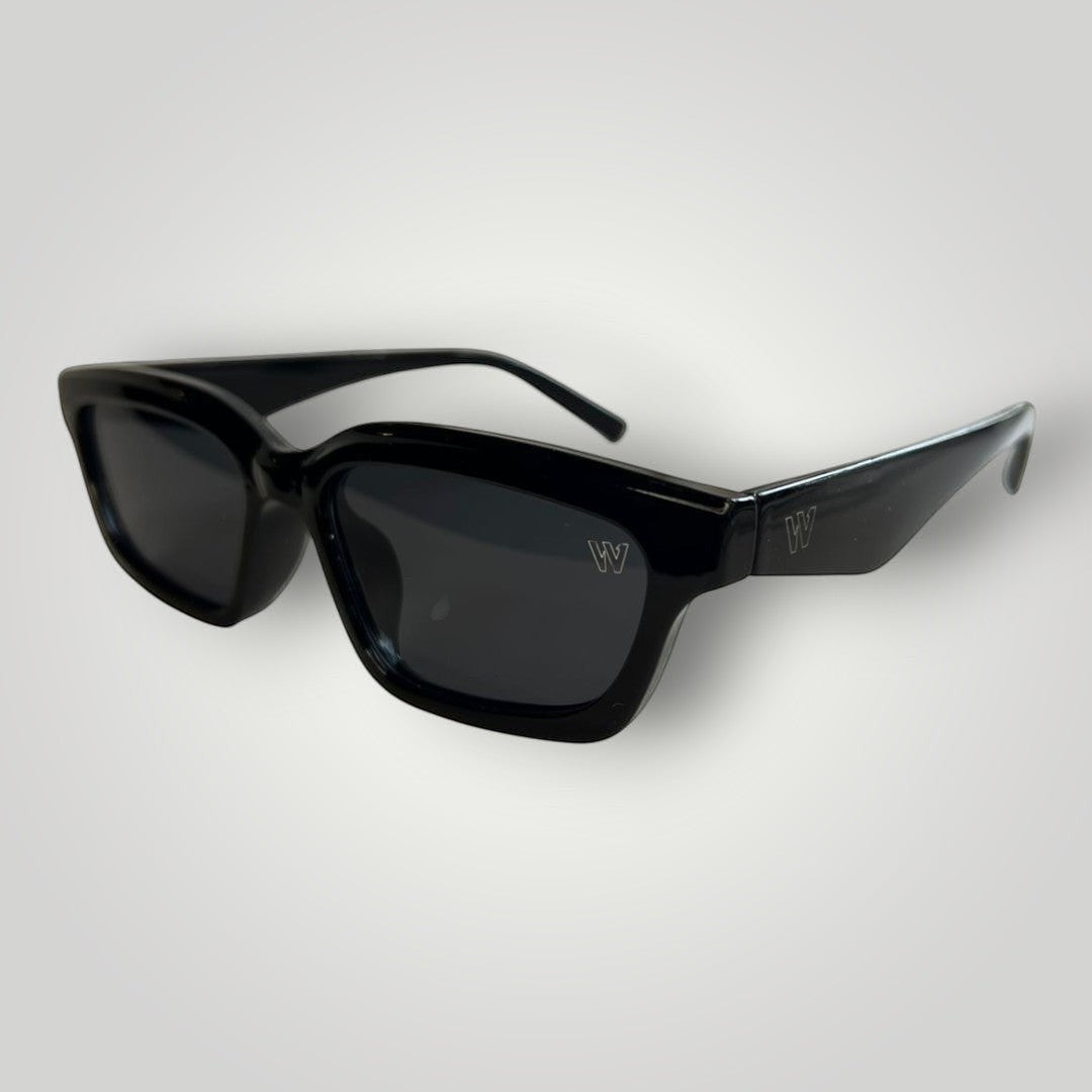 W One Brand Store black acetate rectangular cat-eye sunglasses with dark grey lenses and subtle 'W' logo on temples.