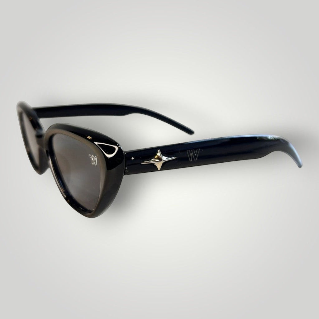 W One Brand Store black acetate cat-eye sunglasses with smoke lenses and silver star detail.