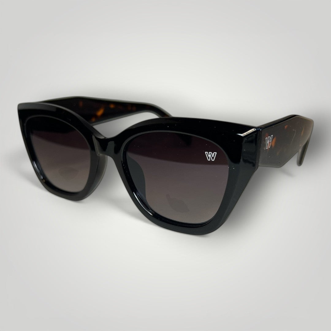 W One Brand Store black cat-eye sunglasses with tortoiseshell accents and gradient black lenses. Features UV400 protection.