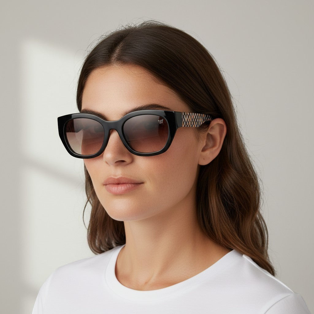 W One Brand Store black acetate cat-eye sunglasses with gradient brown lenses and orange checkered temples.
