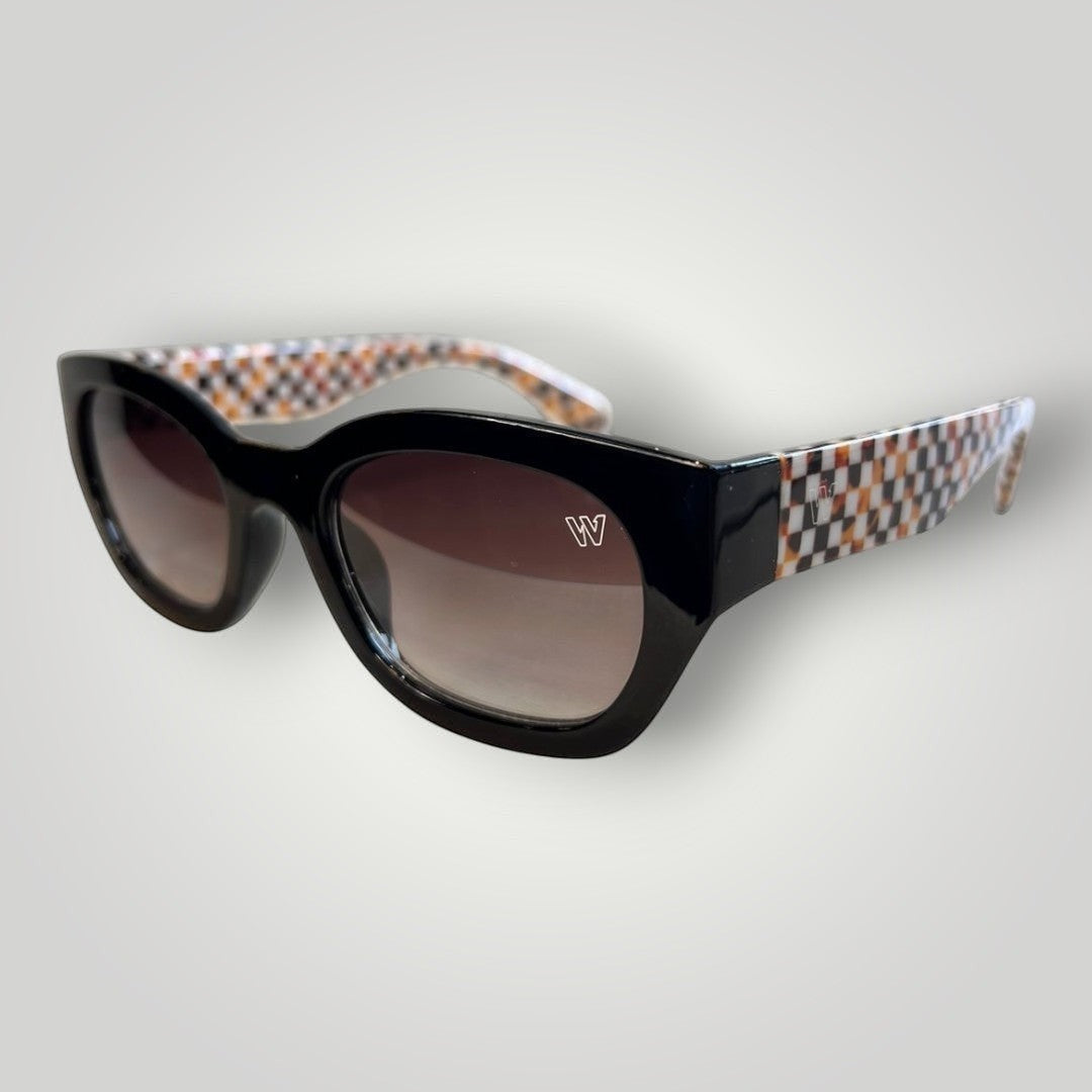 W One Brand Store black acetate cat-eye sunglasses with gradient brown lenses and orange checkered arms.