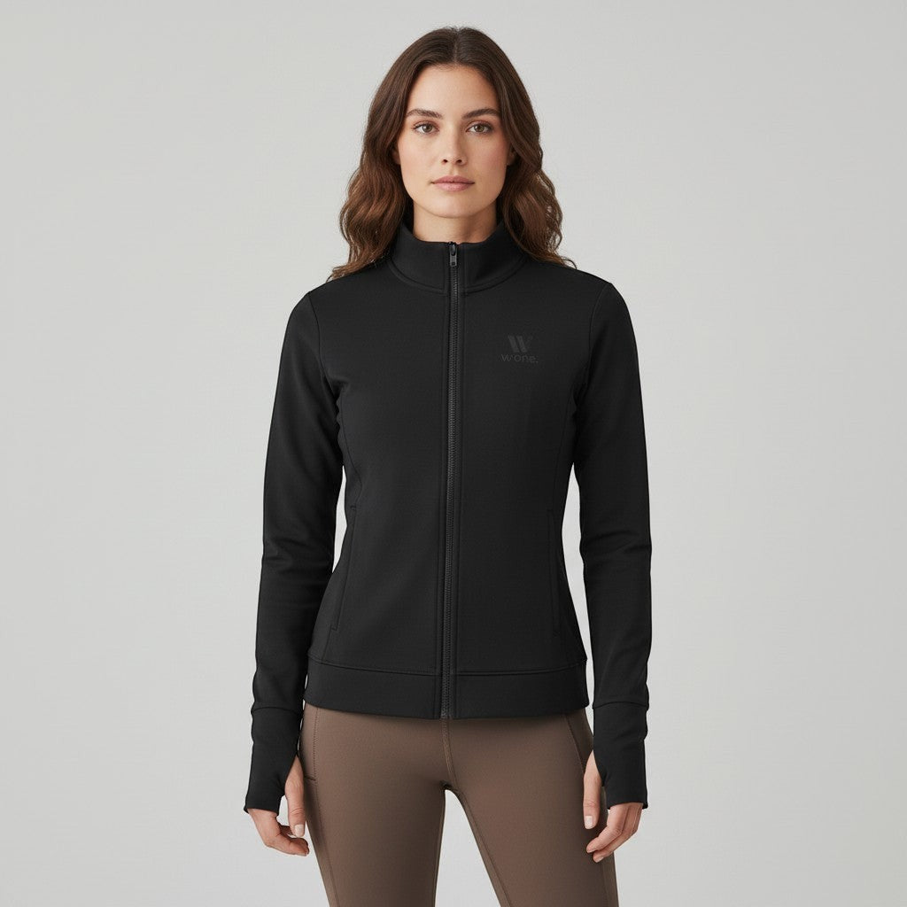 W One Brand Store black polyamide fitness jacket with thumbholes and zip-up front, worn by a model.