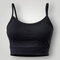 W One Brand Store black polyamide fitness top with adjustable straps and reinforced structure for support and comfort.