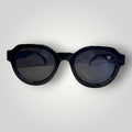 W One Brand Store black acetate round sunglasses with black lenses and subtle 'W' logo detail.