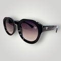 W One Brand Store black acetate round sunglasses with gradient smoke lenses and subtle ridged detailing on the frame.