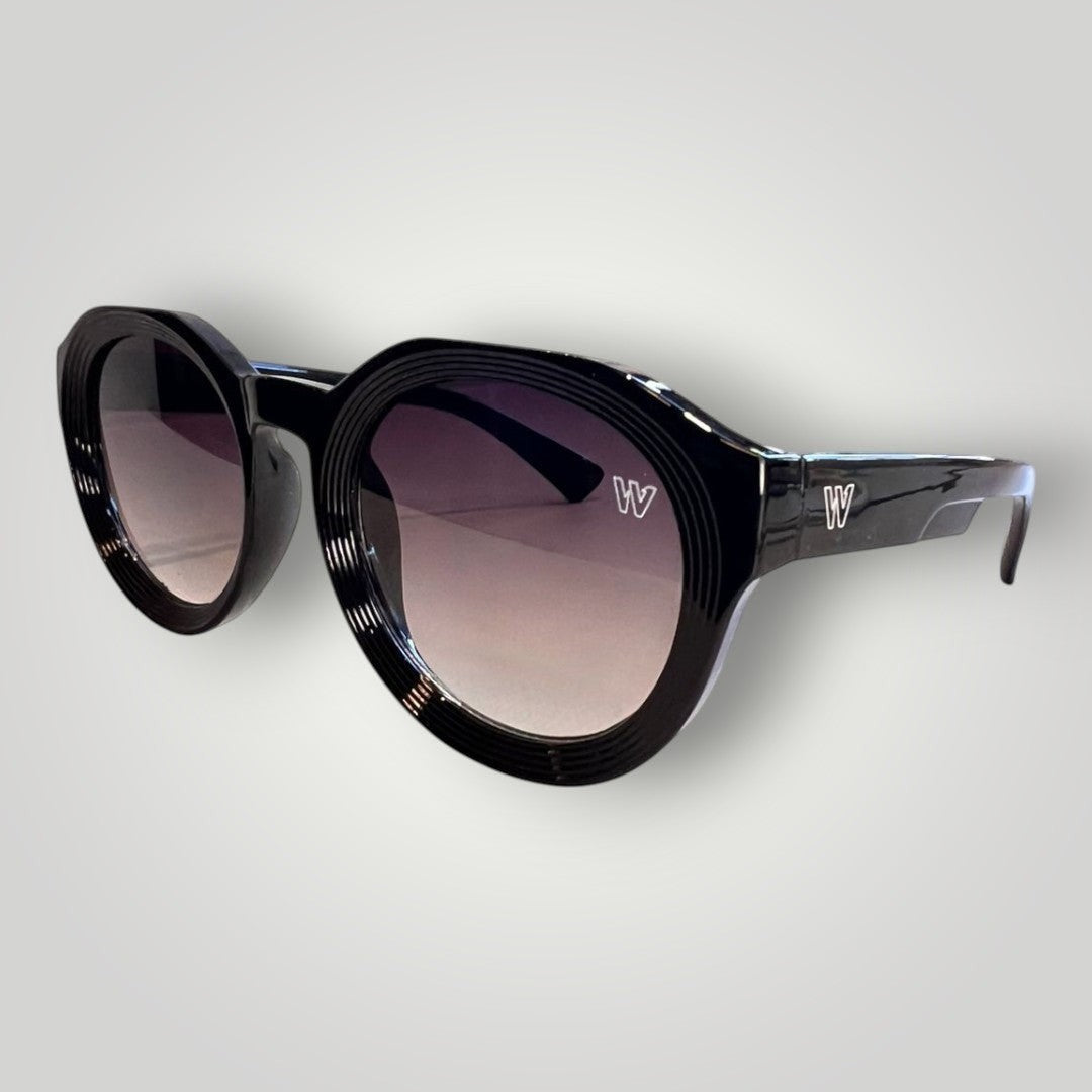W One Brand Store black acetate round sunglasses with gradient smoke lenses and subtle ridged detailing on the frame.