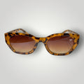 W One Brand Store cat-eye sunglasses in brown tortoise shell acetate with gradient brown lenses and UV400 protection.