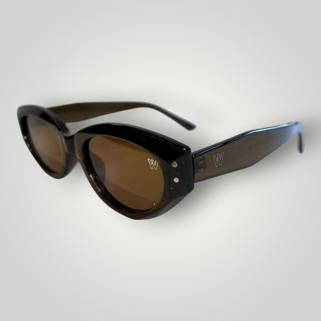 W One Brand Store mini cat-eye sunglasses in translucent brown-green acetate with brown lenses and silver stud details.