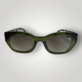 W One Brand Store green acetate cat-eye sunglasses with striped temples and gradient green lenses.