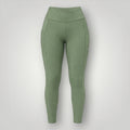 W One Brand Store green polyamide leggings with side pockets and V-shaped waistband, ideal for fitness.