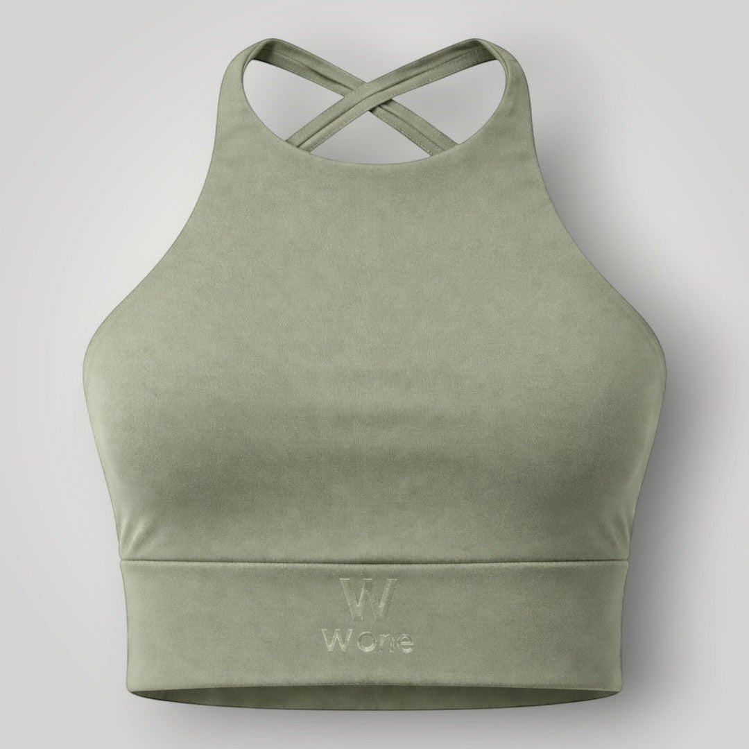 W One Brand Store sage green polyamide sports bra with crossed back straps and subtle embroidered logo.