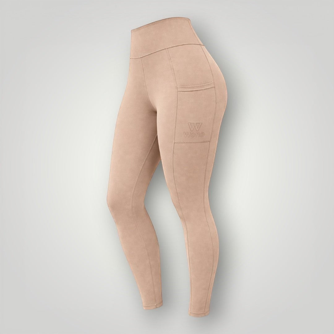 Legging W One Brand Store Move na cor canela com bolso lateral funcional, tecido de poliamida e alta compressão.