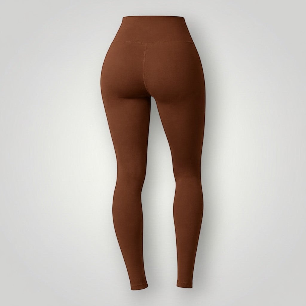 Legging W One Brand Store Essence na cor café, modelo básico de média compressão com tecido respirável e sem costura.