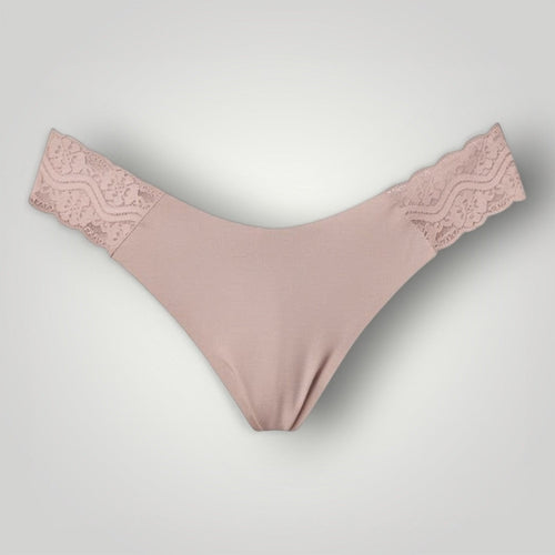 W One Brand Store nude seamless thong with lace sides made of polyamide and elastane, comfortable and delicate.
