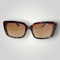 Óculos de sol W One retangular em acetato e metal com estampa tartaruga e lentes marrons. Proteção UV400.
