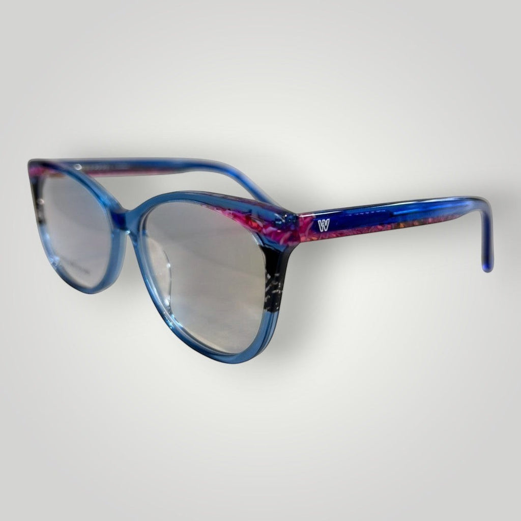 Óculos de grau W One Brand Store gatinho em acetato azul escuro transparente com detalhes rosas