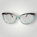 Armação de óculos de grau W One gatinho em acetato azul tiffany transparente com detalhe colorido e hastes fumê.