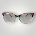 Óculos de grau W One Brand Store gatinho em acetato rosa claro e rosa escuro, com detalhes em verde e armação transparente.