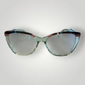Armação de óculos de grau W One em acetato azul tiffany transparente com design gatinho e detalhes coloridos. Moderno e elegante.