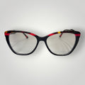 Óculos de grau W One pretos com design gatinho em acetato e detalhes vermelhos e amarelos.