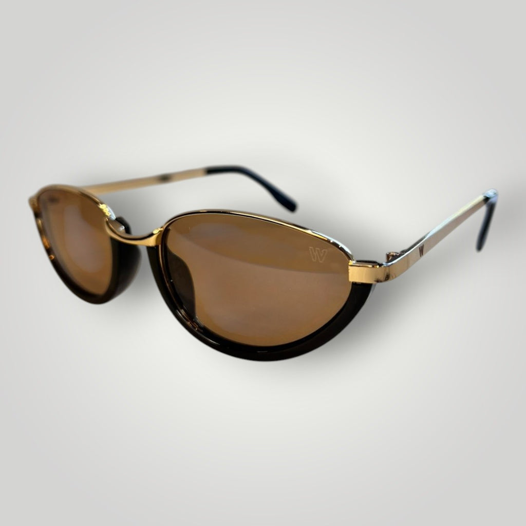 Óculos de sol W One dourados com armação oval em metal e acetato preto, lentes marrons e proteção UV400.