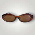 W One Brand Store oval brown acetate sunglasses with brown lenses and UV400 protection.