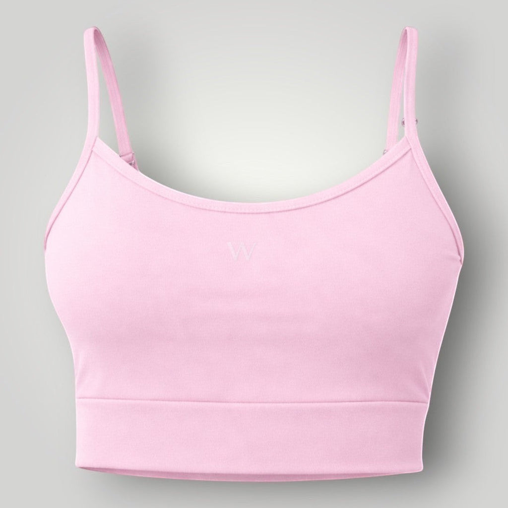W One Brand Store light pink polyamide sports bra with adjustable straps and subtle 'W' logo, ideal for fitness.