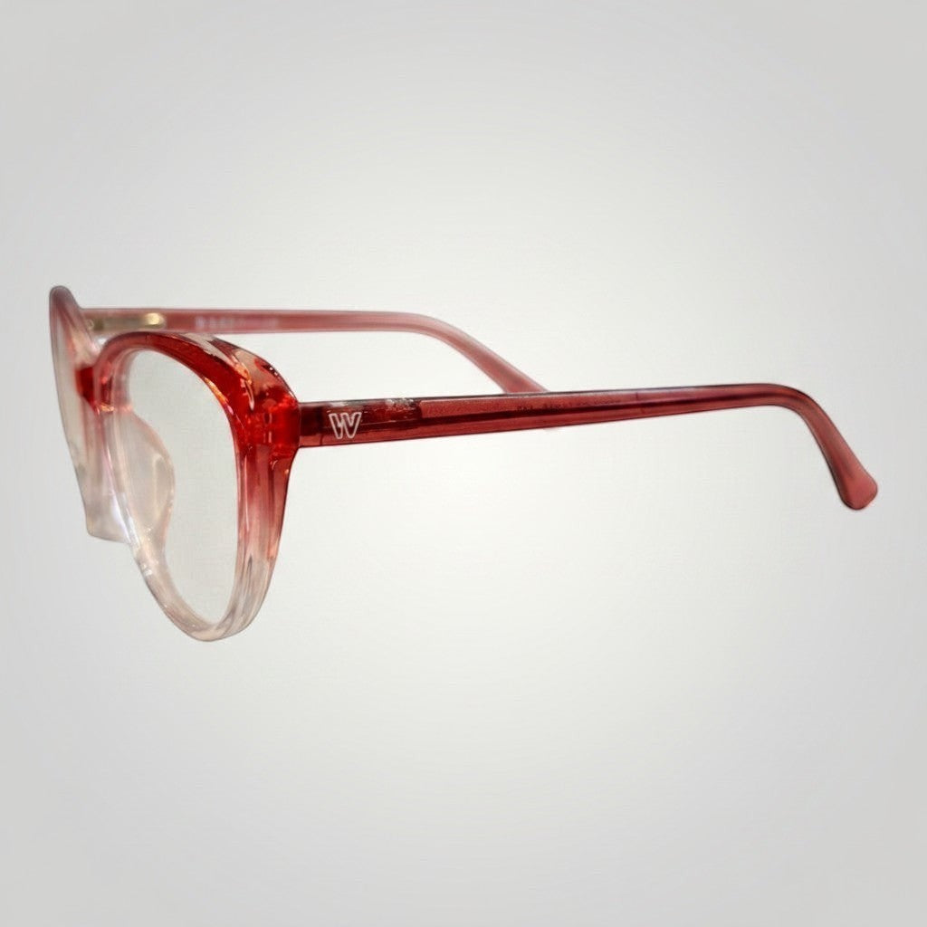 W One Brand Store red transparent polyamide cat-eye prescription glasses frame with subtle gradient.