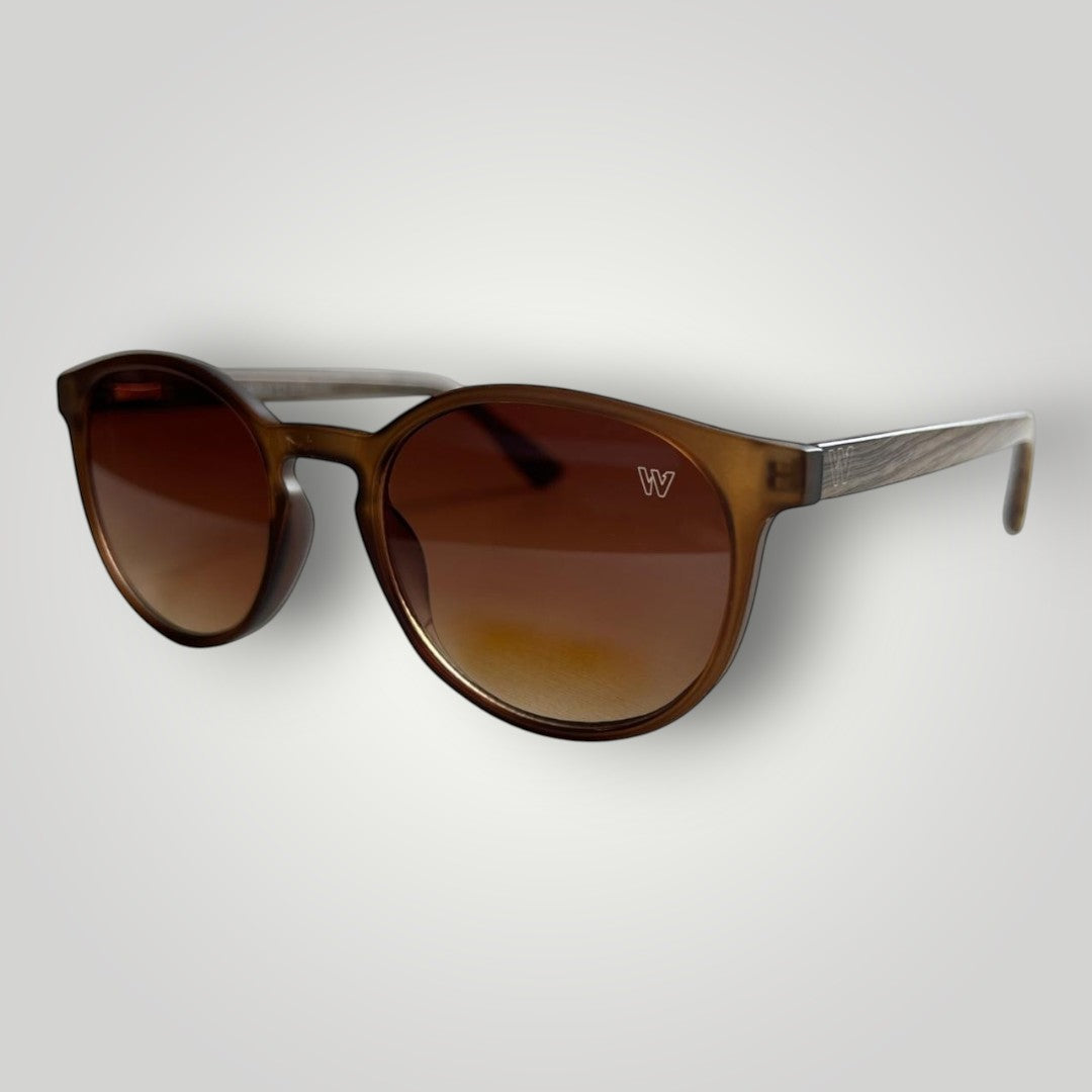 W One Brand Store retro round brown acetate sunglasses with transparent temples and wood-grain detail. UV400 protection.
