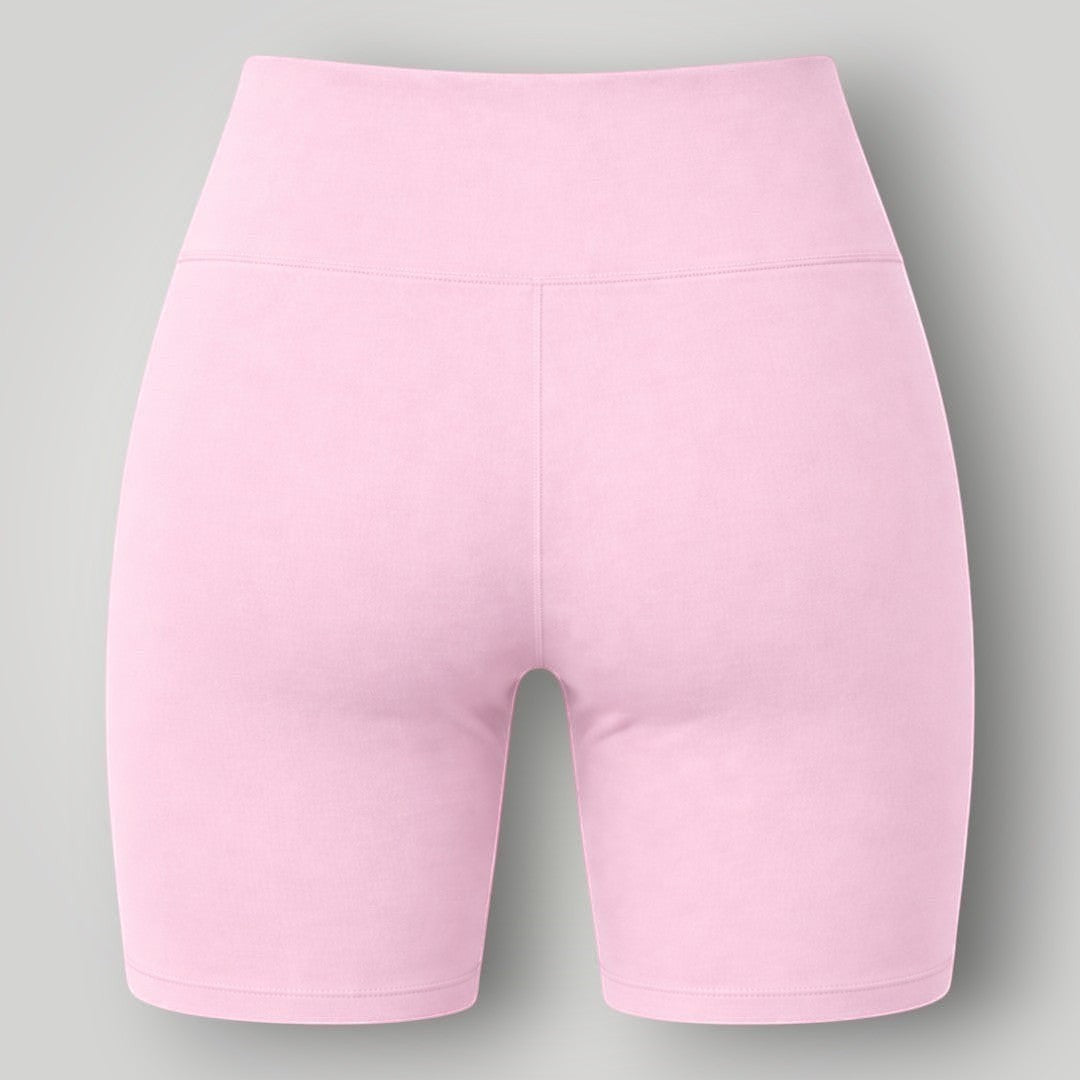 Shorts W One Brand Store Essence rosa balé com cós largo, tecido de poliamida com média compressão e proteção solar.