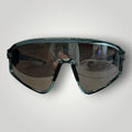 W One Brand Store sporty mask sunglasses in transparent blue injected material with mirrored smoke lenses and UV400 protection.