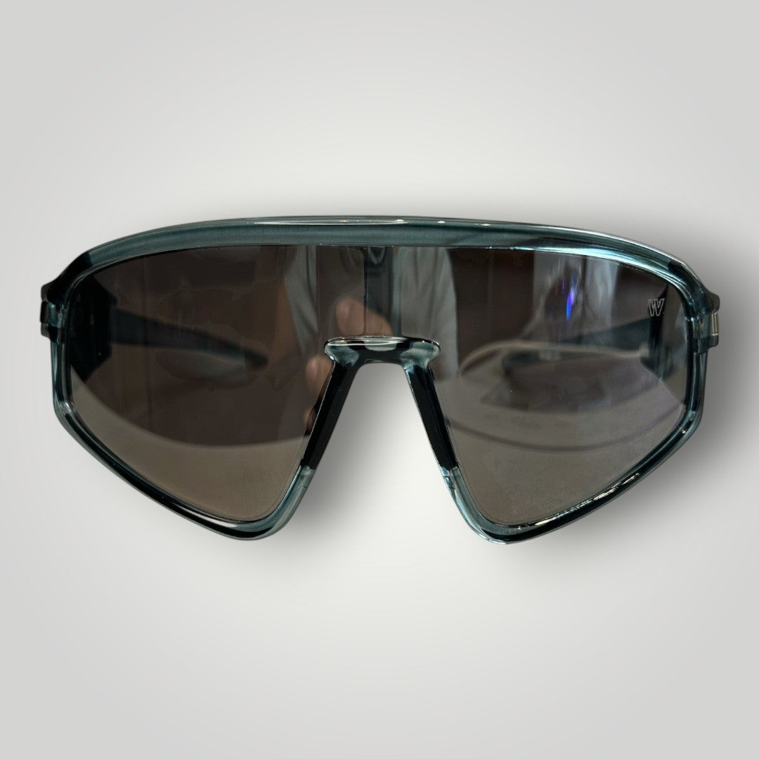 W One Brand Store sporty mask sunglasses in transparent blue injected material with mirrored smoke lenses and UV400 protection.