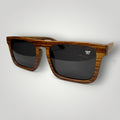 W One Brand Store square polarized sunglasses with black lenses and striped brown acetate temples.