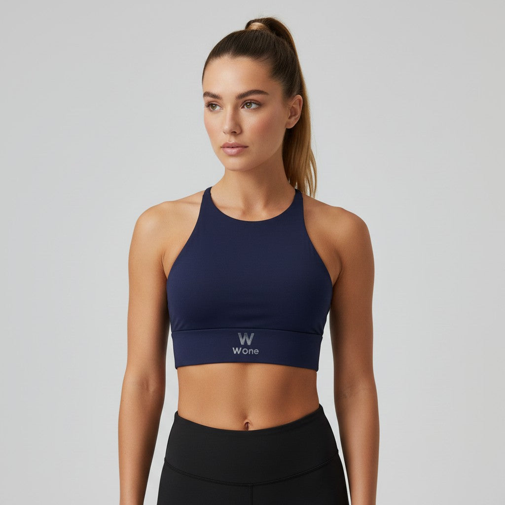 Top W One Fitness azul marinho em poliamida com costas cruzadas e logo discreto na faixa inferior.