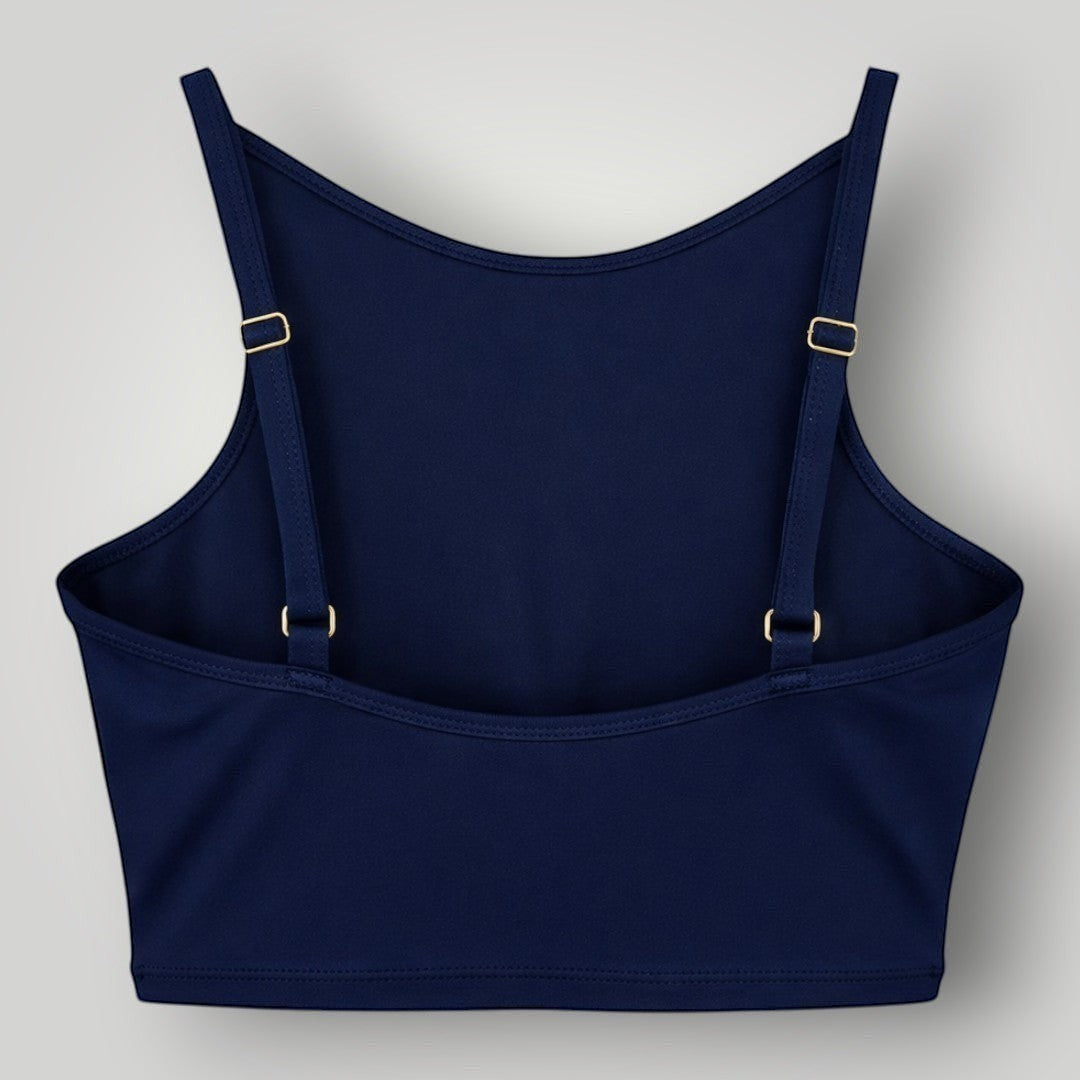 Top W One Brand Store Pulse azul marinho com frente alta, alças reguláveis e faixa nas costas para média sustentação.