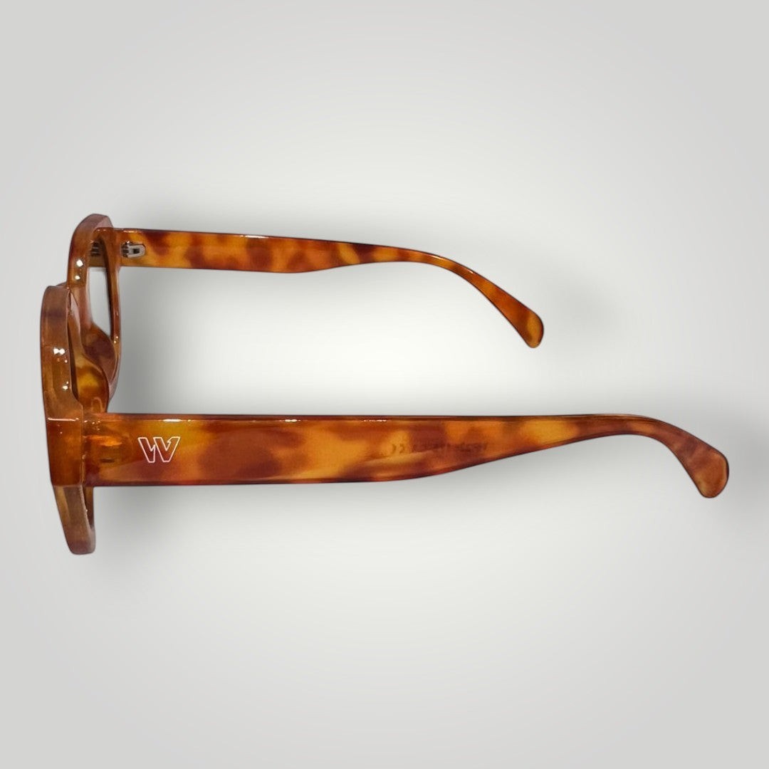 W One Brand Store round acetate sunglasses in a tortoiseshell brown-orange hue with UV400 protection.