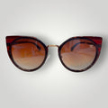 W One Brand Store cat-eye sunglasses in wine acetate with gold details and gradient brown lenses.